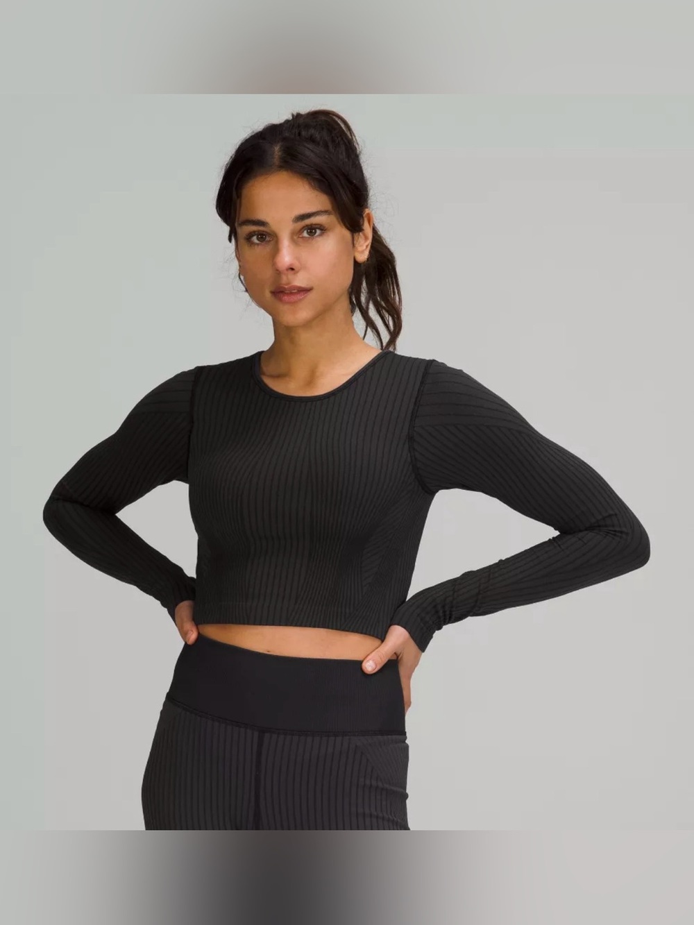 Lululemon cropped long sleeve Ebb to Street top. Built in Bra. Size 4